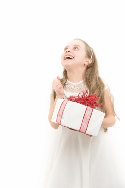 Happy child hold box with red bow