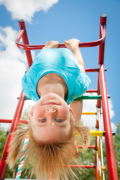 Happy child on a jungle gym