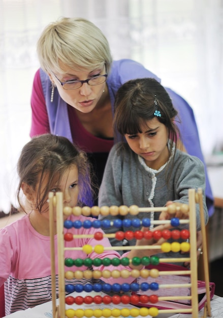 happy child kids group have fun and play at kindergarden indoor preschool education concept with  teacher