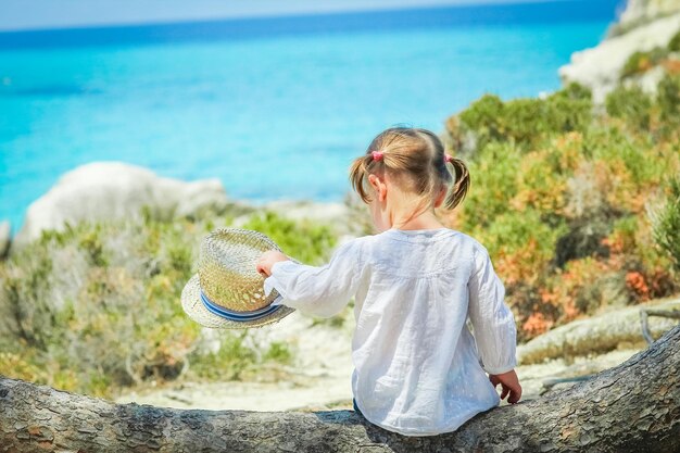 Happy child playing by the sea