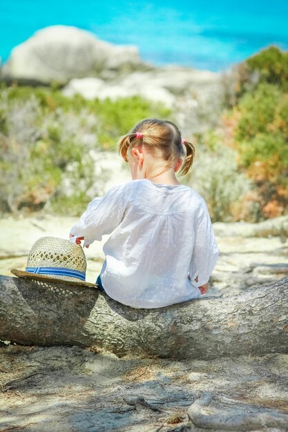 Happy child playing by the sea