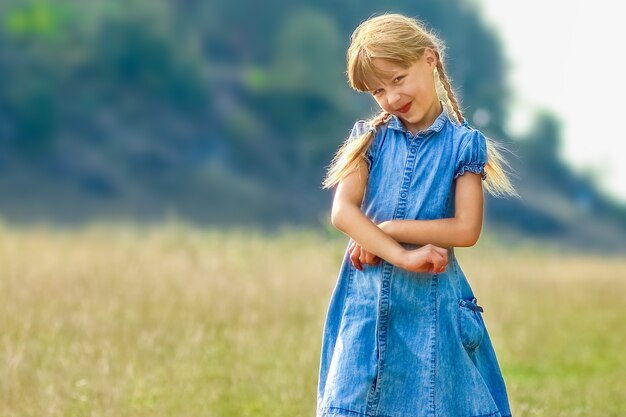 Happy child playing in nature in summer