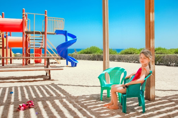 Happy child playing on the sea background