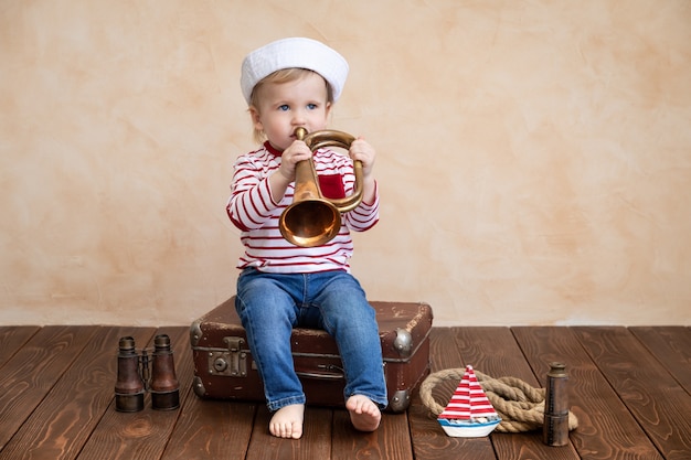 Happy child pretend to be sailor