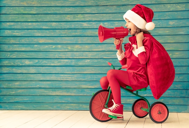 Happy child rides a bike