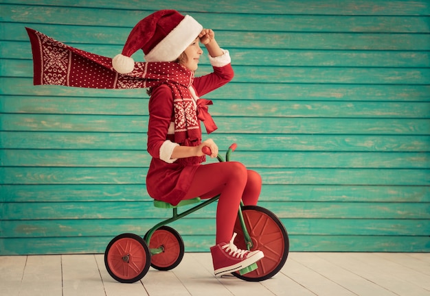 Happy child rides a bike