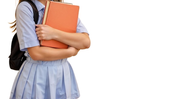 Happy child school girl with book isolated on white background