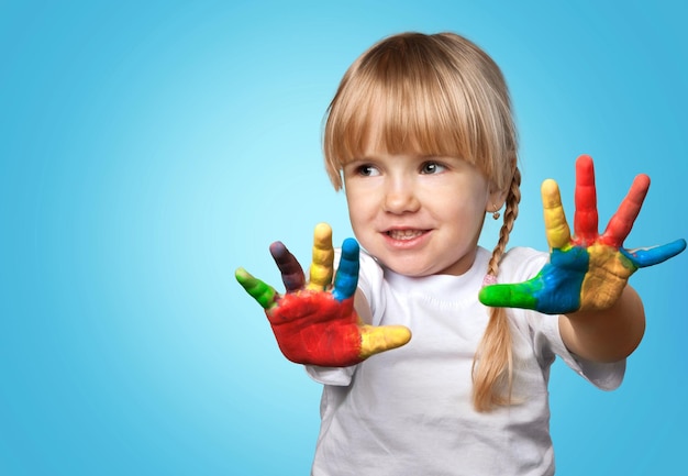 Happy child with painted hands