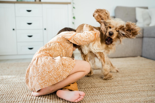 Happy child with pet at home living room