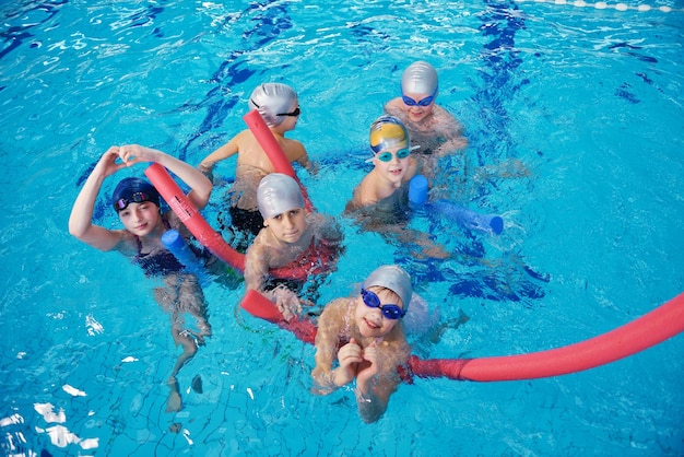 happy children group at swimming pool