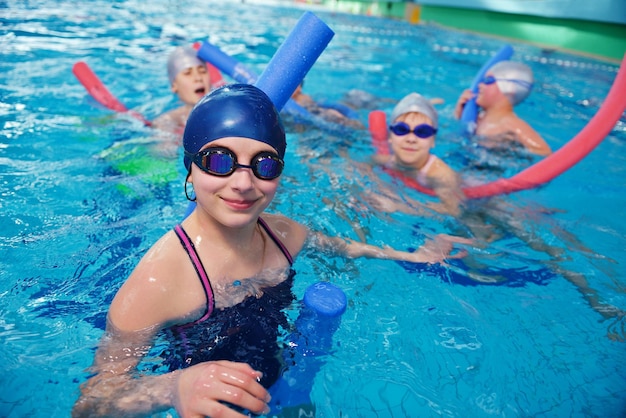 happy children group at swimming pool