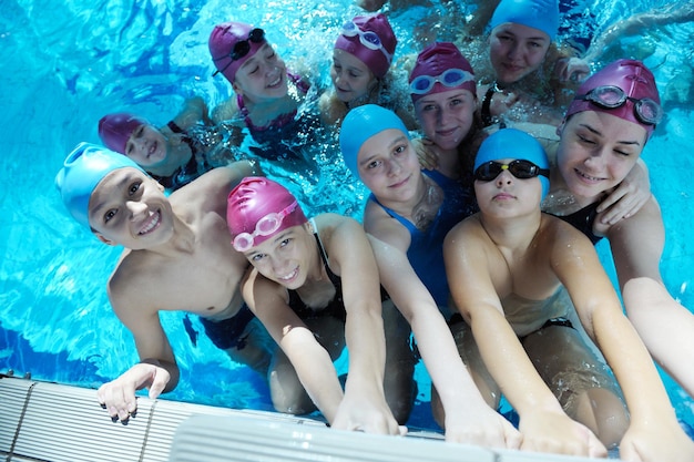 happy children group at swimming pool