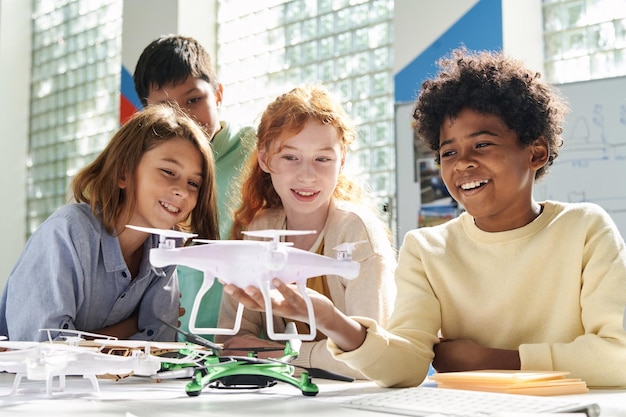 Happy children looking at quadcopter