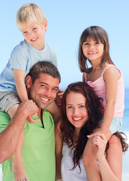 Happy children playing with their parents