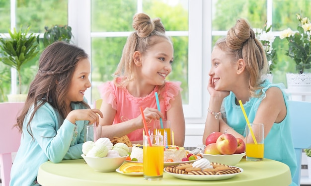 Happy  children with cake at birthday party