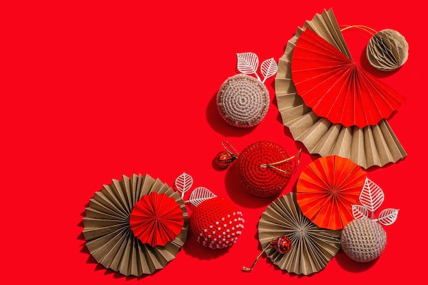 Happy Chinese New Year concept Oriental asian style paper fans traditional decor on red background minimal concept flat lay top view