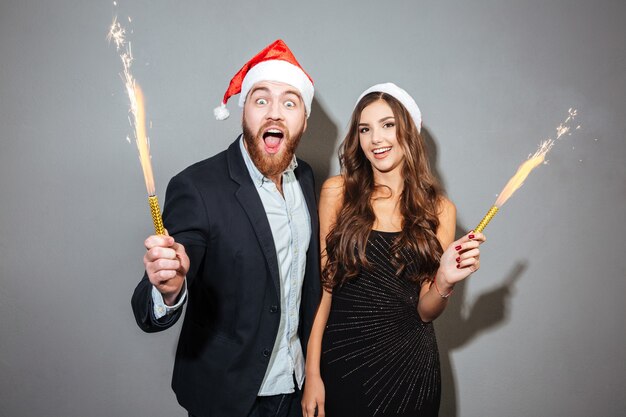 Happy christmas couple with sparklers