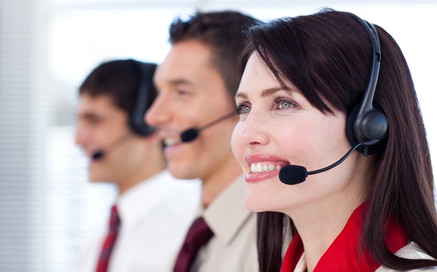 Happy co-workers with headsets on