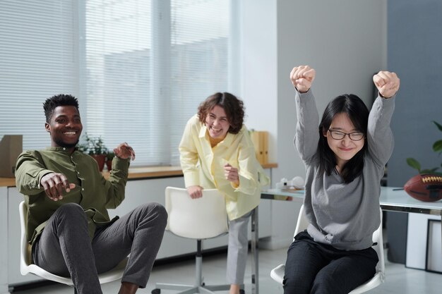 Happy colleagues having fun in office