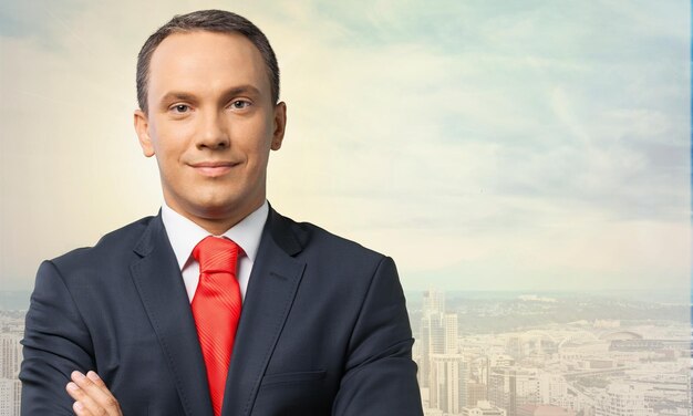 Happy confident businessman wearing red tie