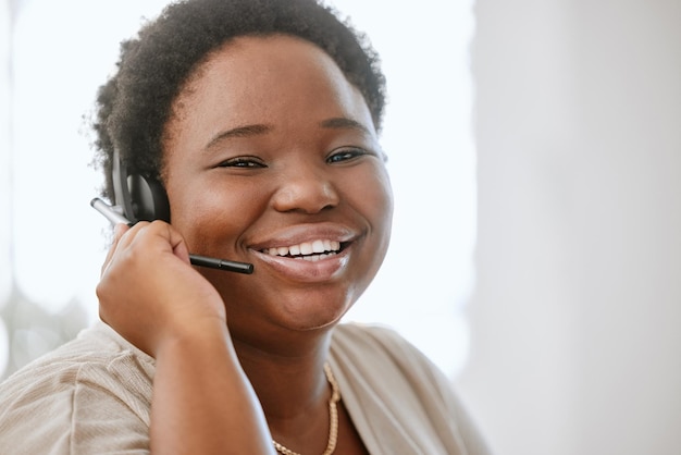 Happy confident and professional call center agent or business consultant working in telesales on call with headset For good customer service success contact us for online faq helpdesk support