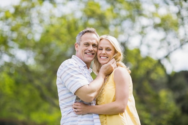 Happy couple about to kiss outside