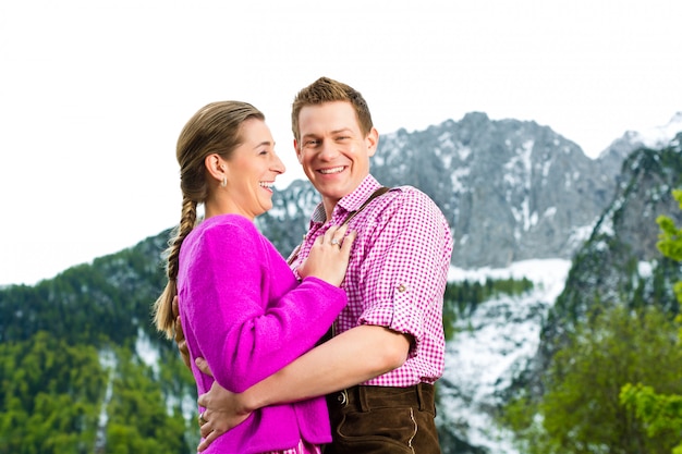 Happy couple in Alpine meadow