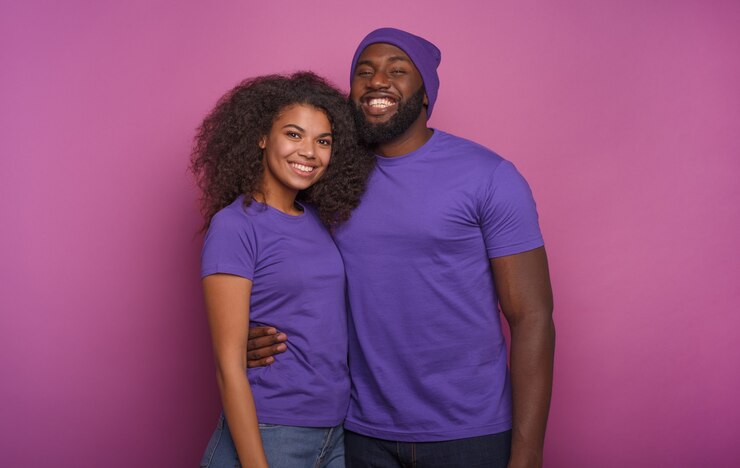 Happy couple are smiling. Concept of happiness. Purple background