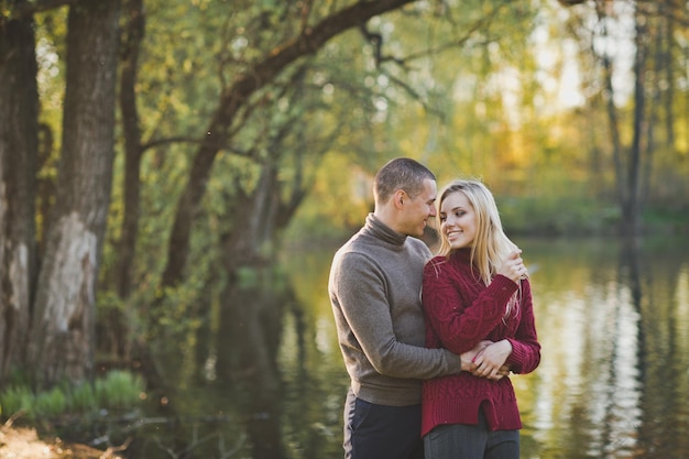 Happy couple on the background of a summer pond 1424