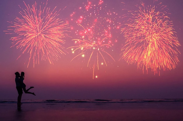 happy couple on the beach enjoying the sunset: concept of independence of america and valentines day.