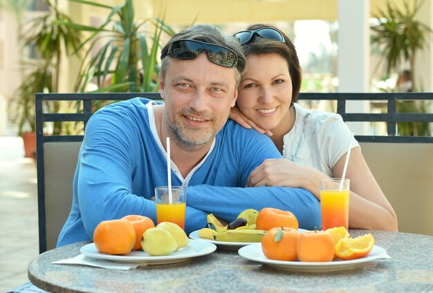 Happy couple at breakfast on the table