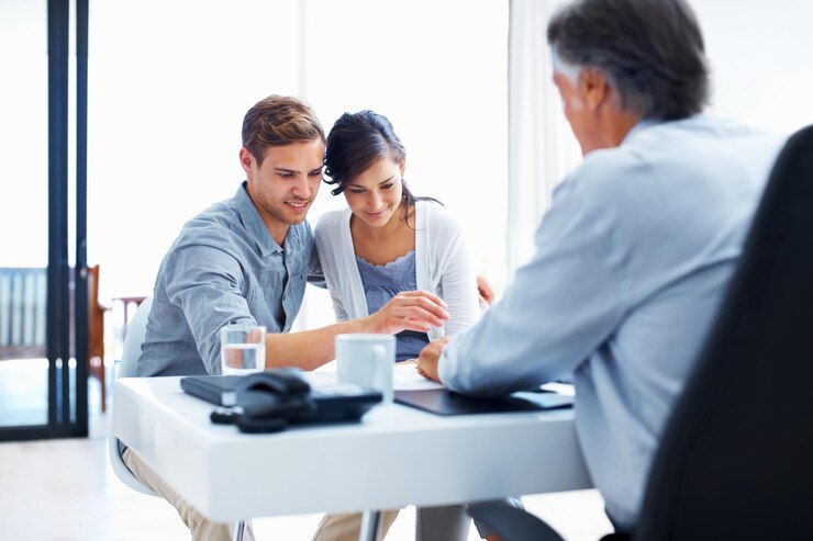 Photo happy couple broker and paperwork in office for consultation investment and financial advisor woman man and consultant for insurance agency with cover agreement and mortgage for wealth planning