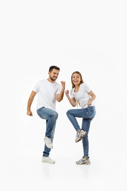 Happy couple in casual outfit dancing