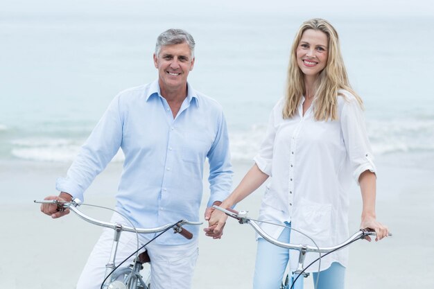 Happy couple cycling together