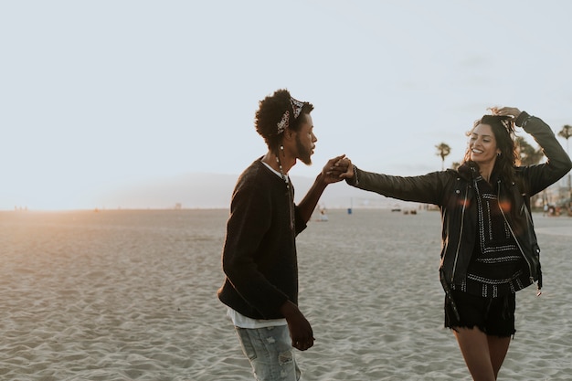 Happy couple dancing at the beach