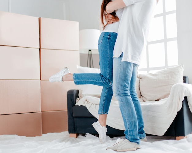 Happy couple on the day of moving into their new apartment. photo with copy-space