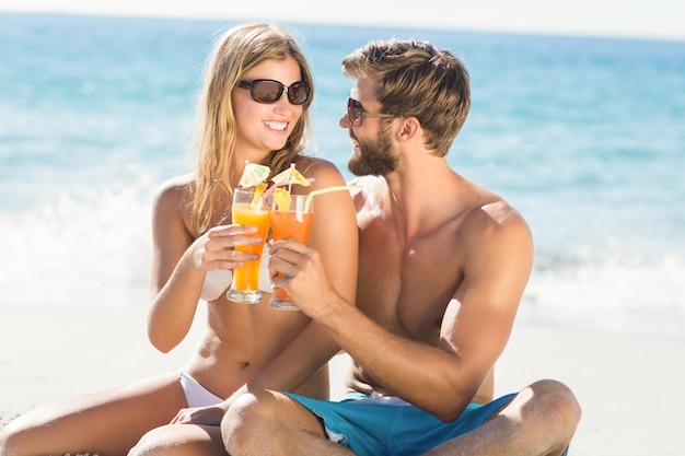 Happy couple drinking a cocktail