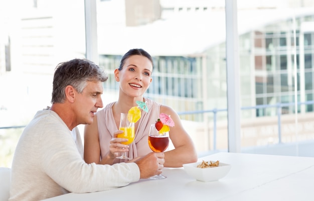 Happy couple drinking a glass 