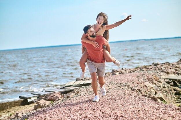 A happy couple feeling amazing spending time on a beach