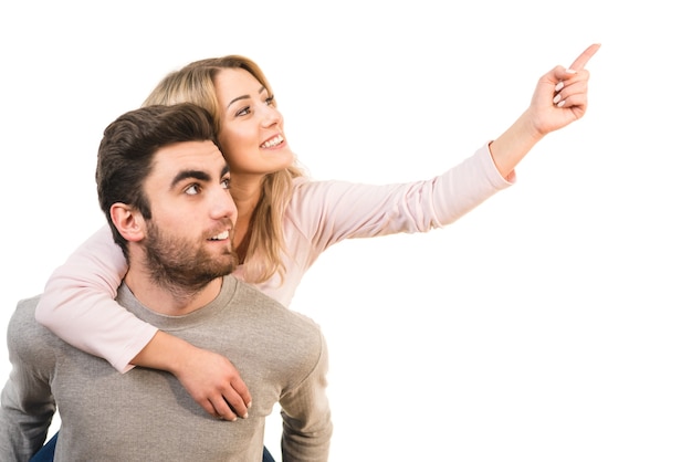 The happy couple gesturing on the white background