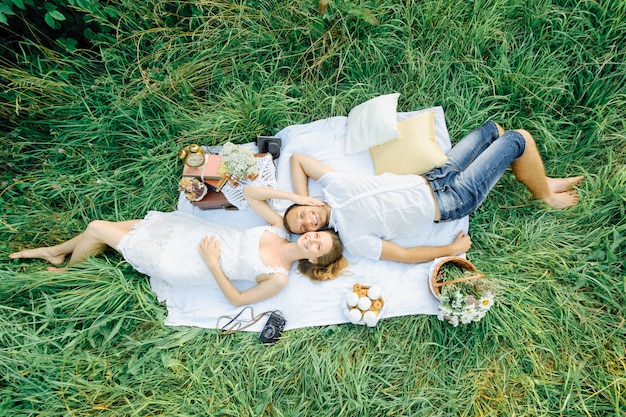 Happy couple have fun in the park on nature