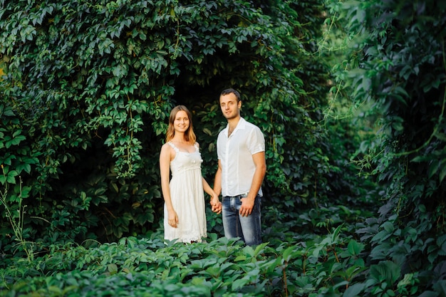 Happy couple have fun in the park on nature