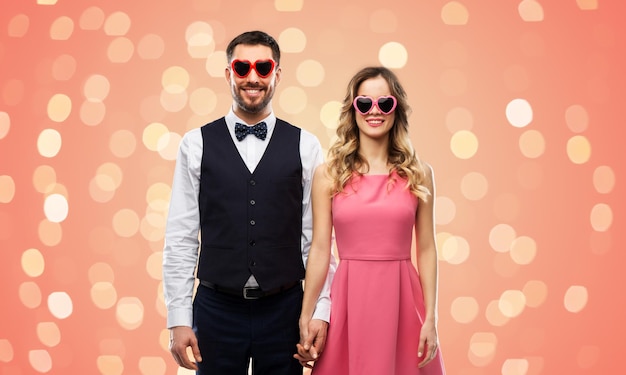 happy couple in heartshaped sunglasses