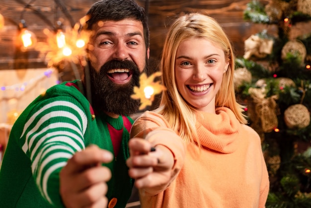 happy couple holding bengal lights