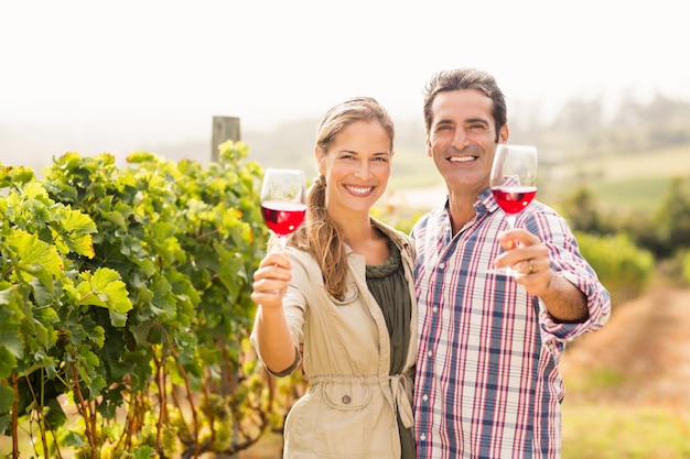 Happy couple holding glasses of wine