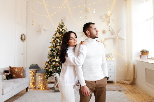 Happy couple at home on Christmas time