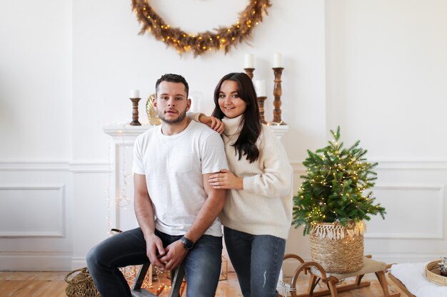 Happy couple at home on Christmas time