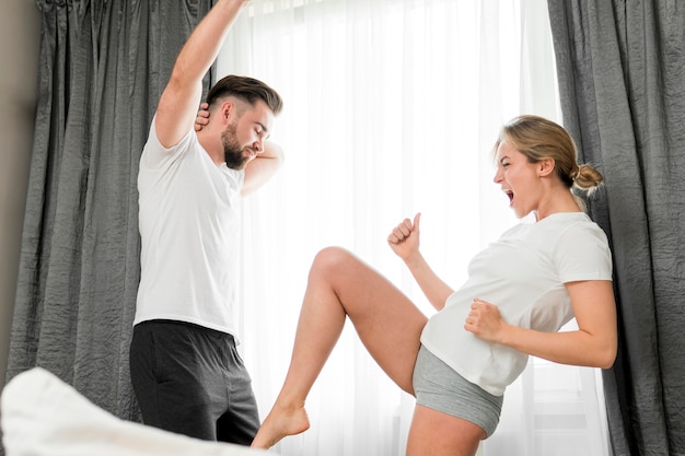 Photo happy couple indoors fooling around together