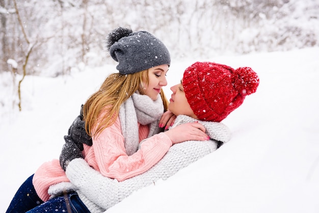 Happy couple lay down in snow