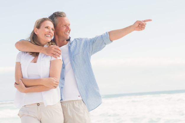 Happy couple looking to sea